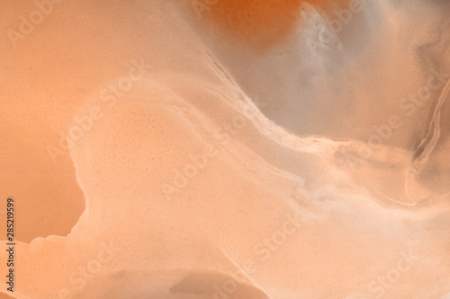 Hand painted alcohol ink background. Abstract delicate orange texture. Contemporary autumn wallpaper. 