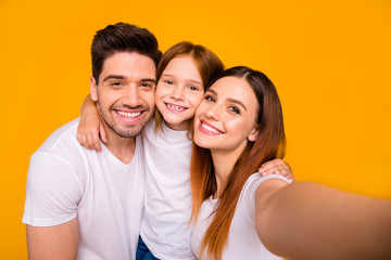 Self-portrait of three nice attractive charming cute lovely tender sweet kind cheerful cheery glad careful person cuddling embracing isolated over bright vivid shine yellow background