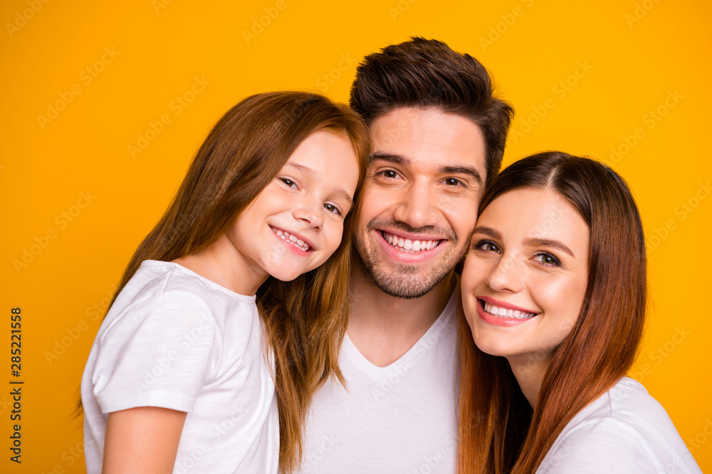 Close-up portrait of three nice attractive charming cute lovely sweet tender kind careful cheerful cheery person spending holiday time isolated over bright vivid shine yellow background Close-up portrait of three nice attractive charming cute lovely sweet tender kind careful cheerful cheery person spending holiday time isolated over bright vivid shine yellow background