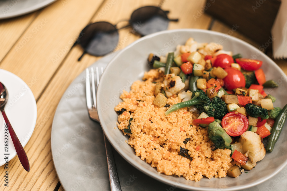 a plate of couscous with vegetables