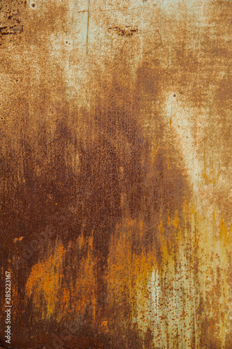 Rusty orange metal background with spots and scratches.