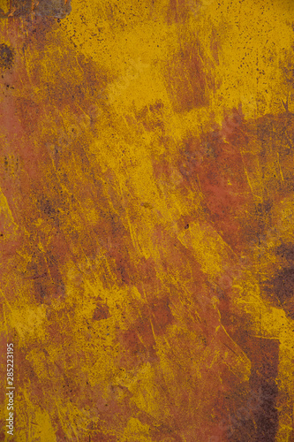 Rusty orange metal background with spots and scratches.