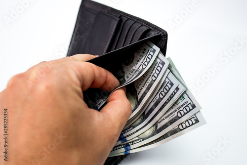 wallet with money in hand isolated on white