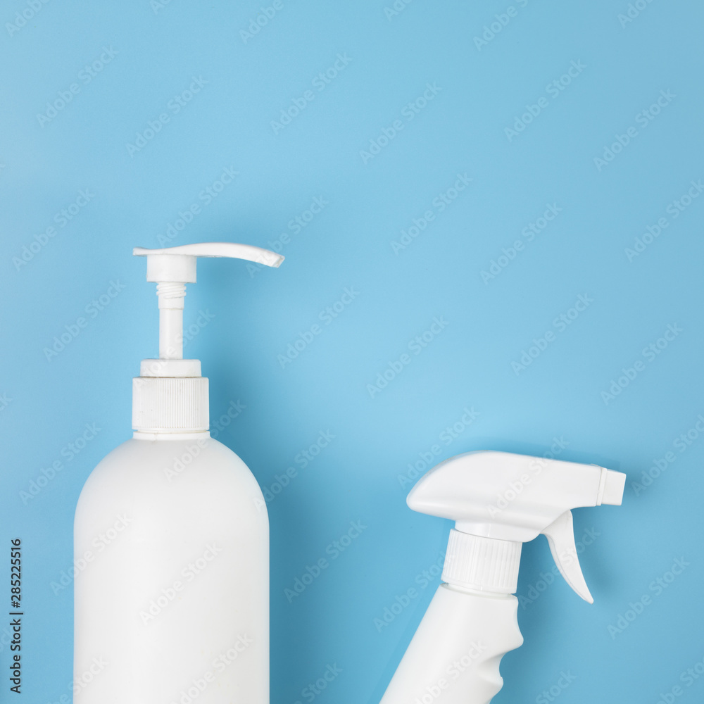 Flat lay arrangement with spray and soap bottles Flat lay arrangement with spray and soap bottles