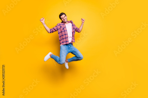 Full length body size photo of rejoicing overjoyed screaming man full of emotions because of victory while isolated with vivid background