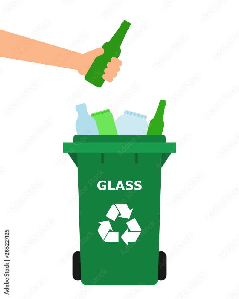 Hand throwing green glass bottle into a recycle bin. Glass recycle