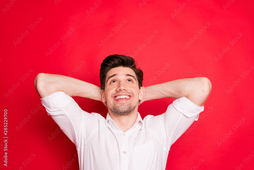 Close-up portrait of his he nice attractive lovely cheerful cheery glad content guy enjoying free time looking up isolated over bright vivid shine red background Close-up portrait of his he nice attractive lovely cheerful cheery glad content guy enjoying free time looking up isolated over bright vivid shine red background