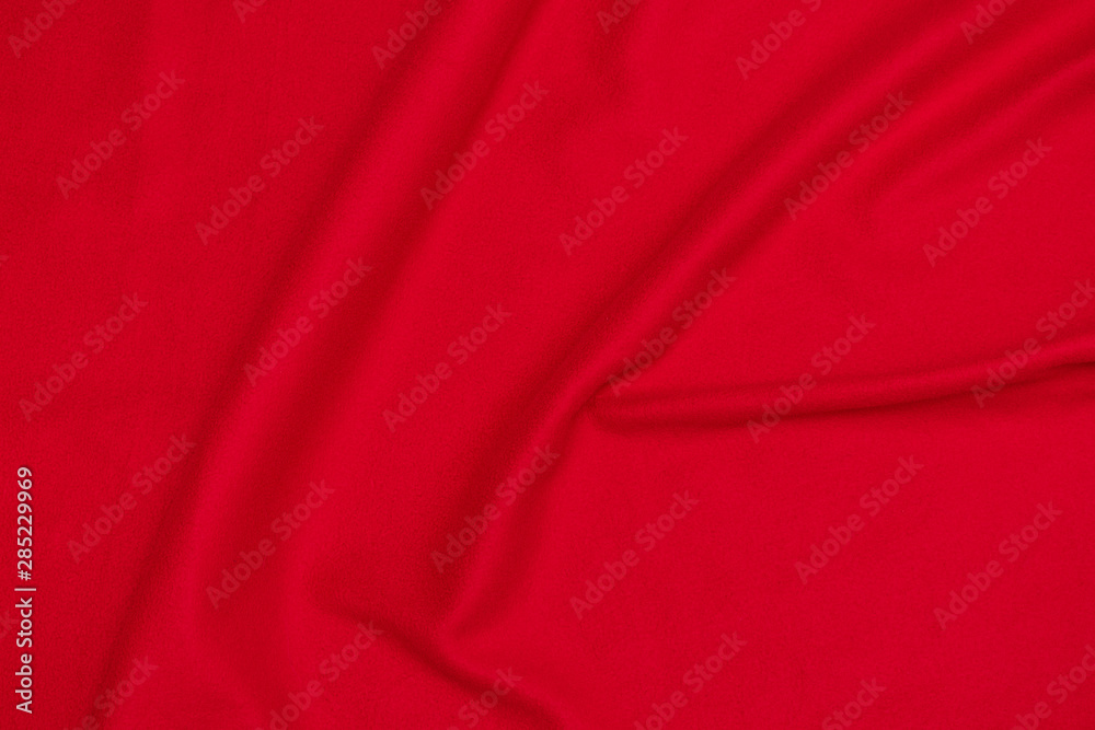 Red crumpled blanket, texture, top view Red crumpled blanket, texture, top view