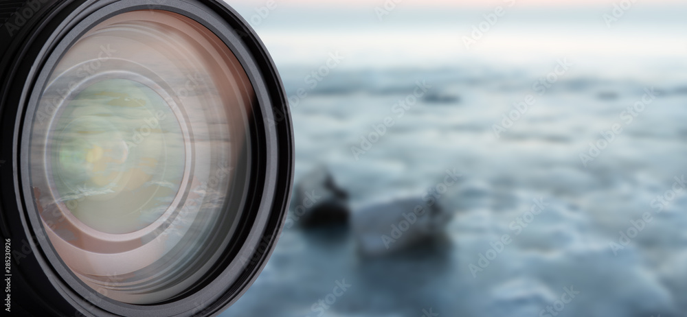 DSLR Camera Lens Isolated. Closeup Reflections in Lens. Blurred Background and Abstract Bokeh.