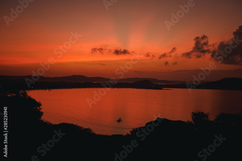 Scenic sunrise view at Merese hill  Lombok island  Indonesia.Beautiful golden sunset sunrise over the sea behind mountains in background