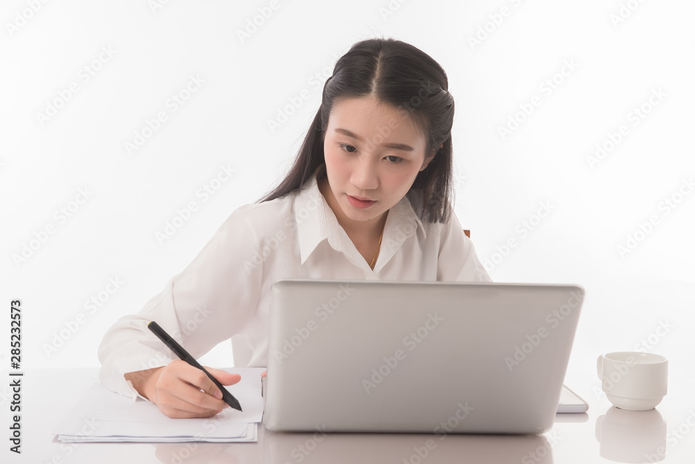 Portrait of business asian woman working on desk on white background. Portrait of business asian woman working on desk on white background.