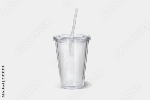 3d illustration plastic tumbler glasse with lid and straw on a white surface. Travel cups isolated on white background