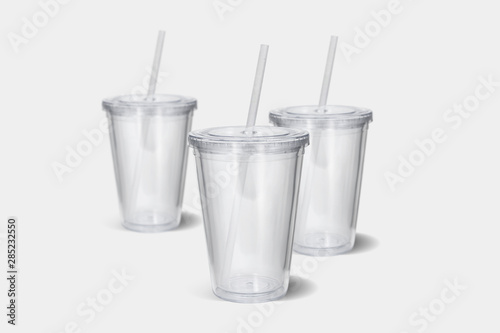 3d illustration plastic tumbler glasses with lid and straw on a white surface. Travel cups isolated on white background