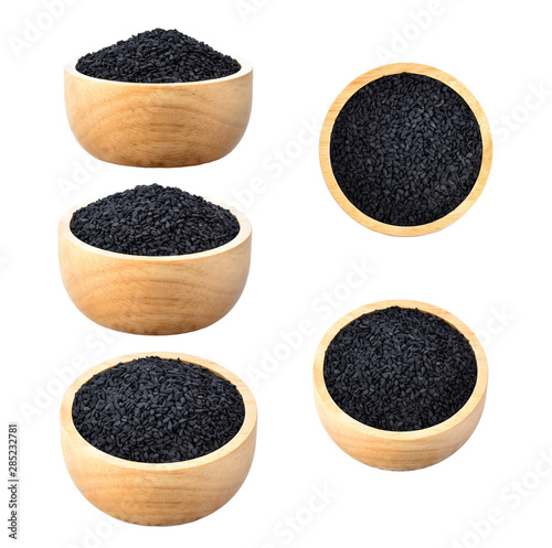 sesame seed isolated in wood bowl on white background