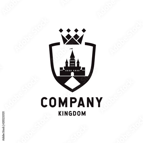 Shield crown logo design with kingdom silhouette inside