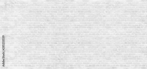 Panoramic background of wide old white brick wall texture. Home or office design backdrop photo