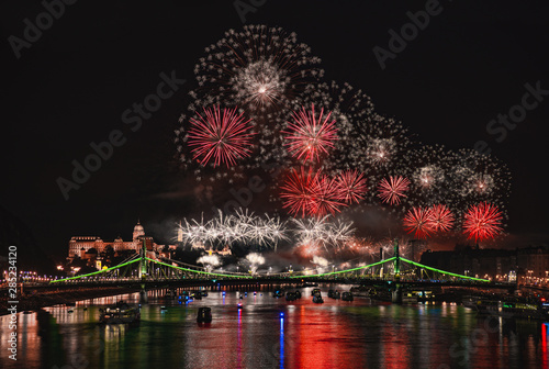 Photography Colorful red fireworks over Budapest, River Danube with bridges, night