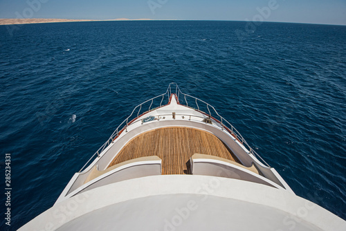 View over the bow over a large motor yacht © Paul Vinten