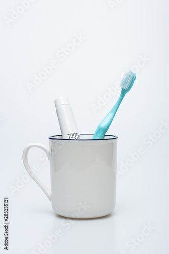 Toothbrush, toothpaste and cup