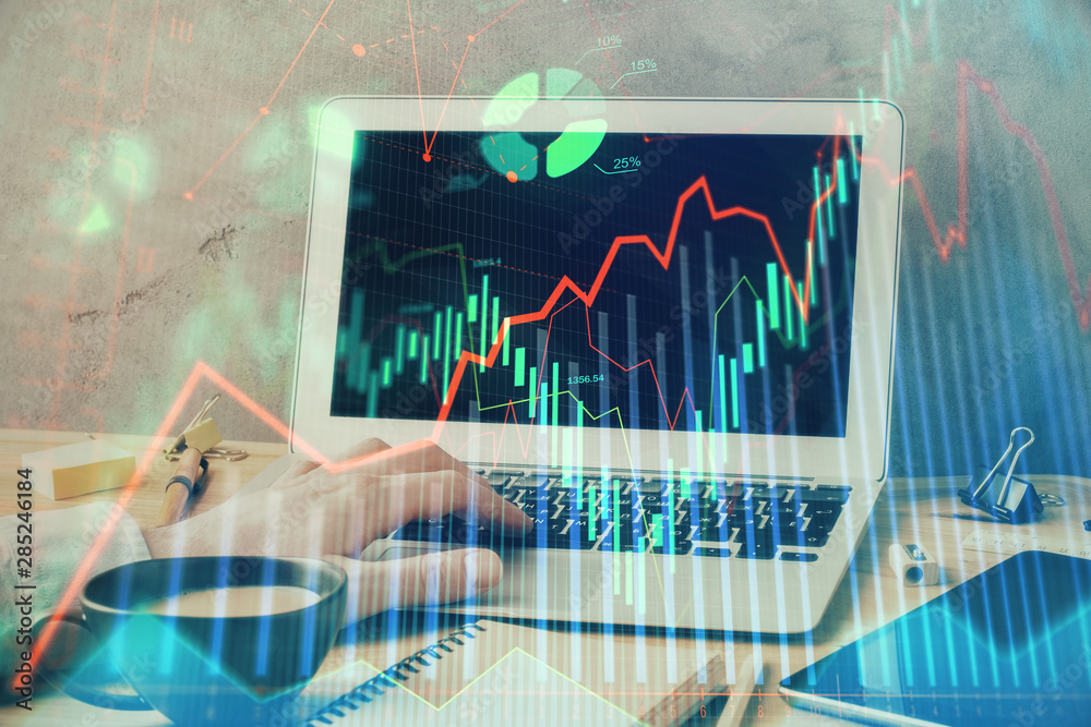 Forex graph with businessman working on laptop on background. Concept of hardworking. Multi exposure. Forex graph with businessman working on laptop on background. Concept of hardworking. Multi exposure.