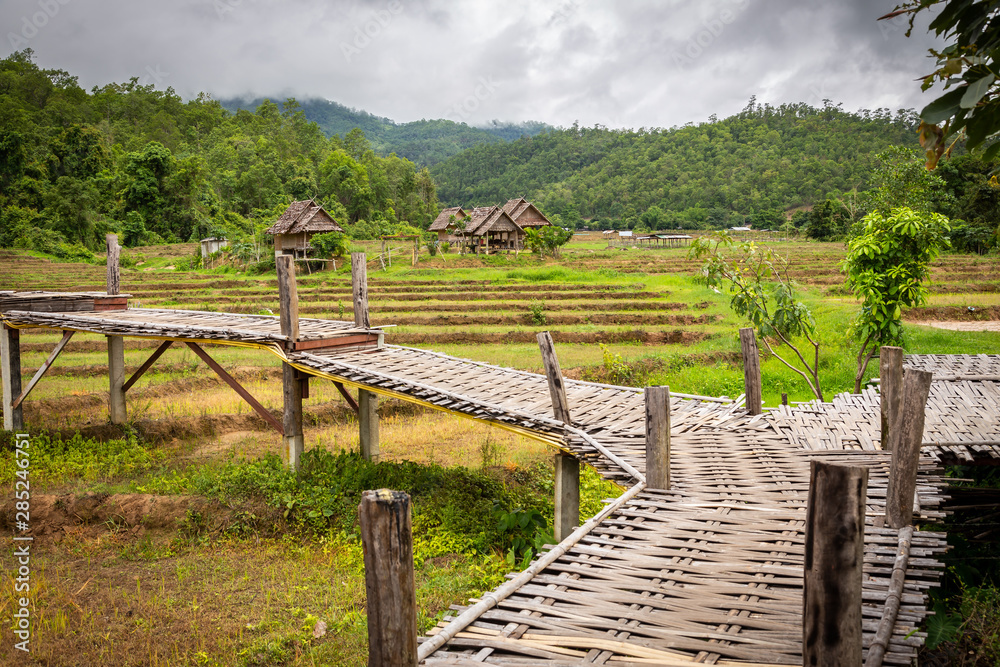 Mountain view and beautiful landscape bamboo bridge,Boon Bridge or Kho Koo So over rice fields in outdoor green nature in the valley,travel in Pai,Chiang Mai,Thailand