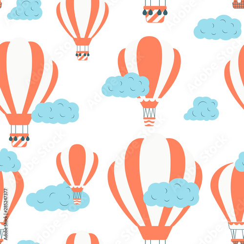 Seamless pattern with hot air balloons in the sky with clouds. Cute vector baby background. Vector wallpaper for children concept.