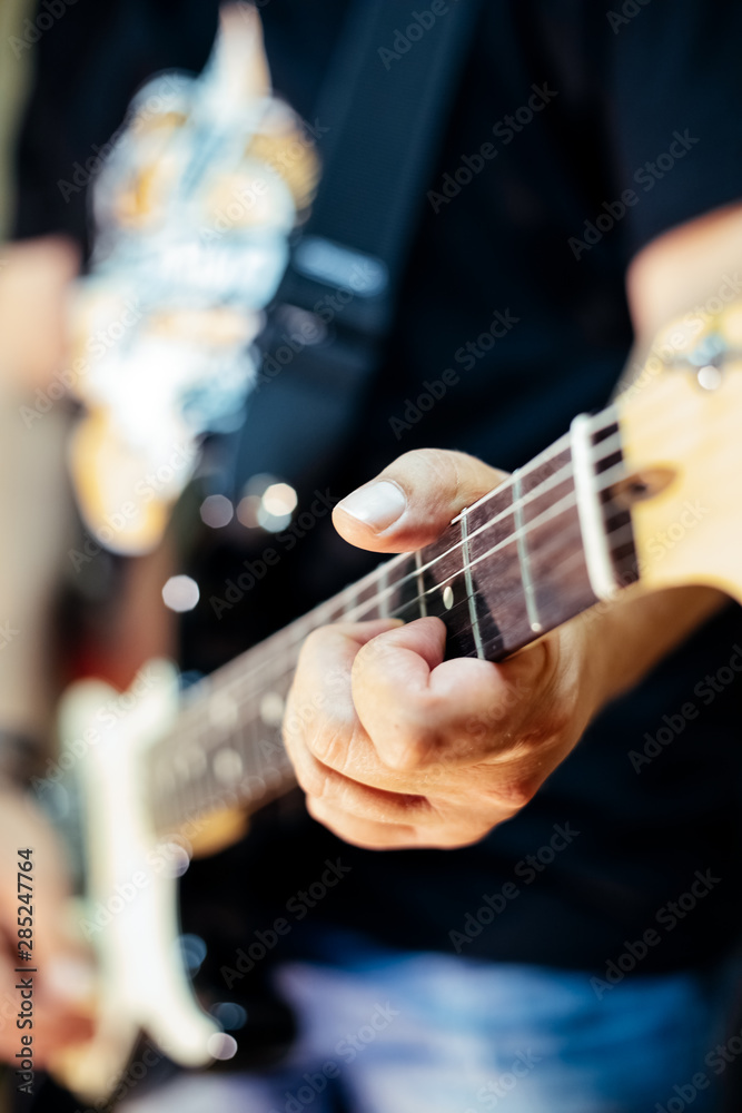 Fototapeta premium Detail of a rocker playing the electric guitar