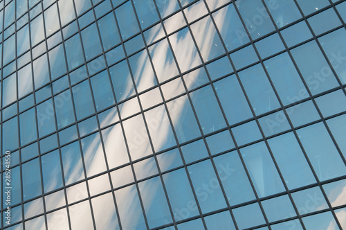 Sky reflection and clouds in the windows of a skyscraper