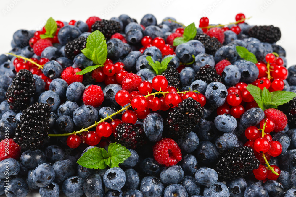 Blackberry, raspberry, blueberry, red currant and mint background. Blackberry, raspberry, blueberry, red currant and mint background.