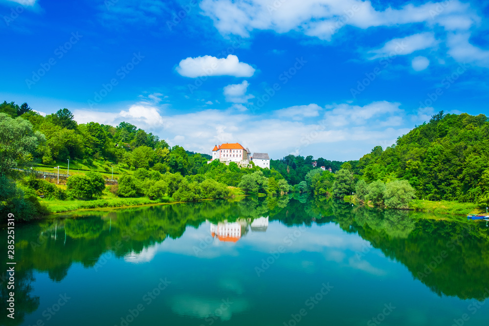 River Kupa and beautiful old Ozalj Castle on the hill in town of Ozalj, Croatia