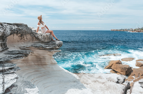 Female enjoying the summer sun by the coast in Australia photo