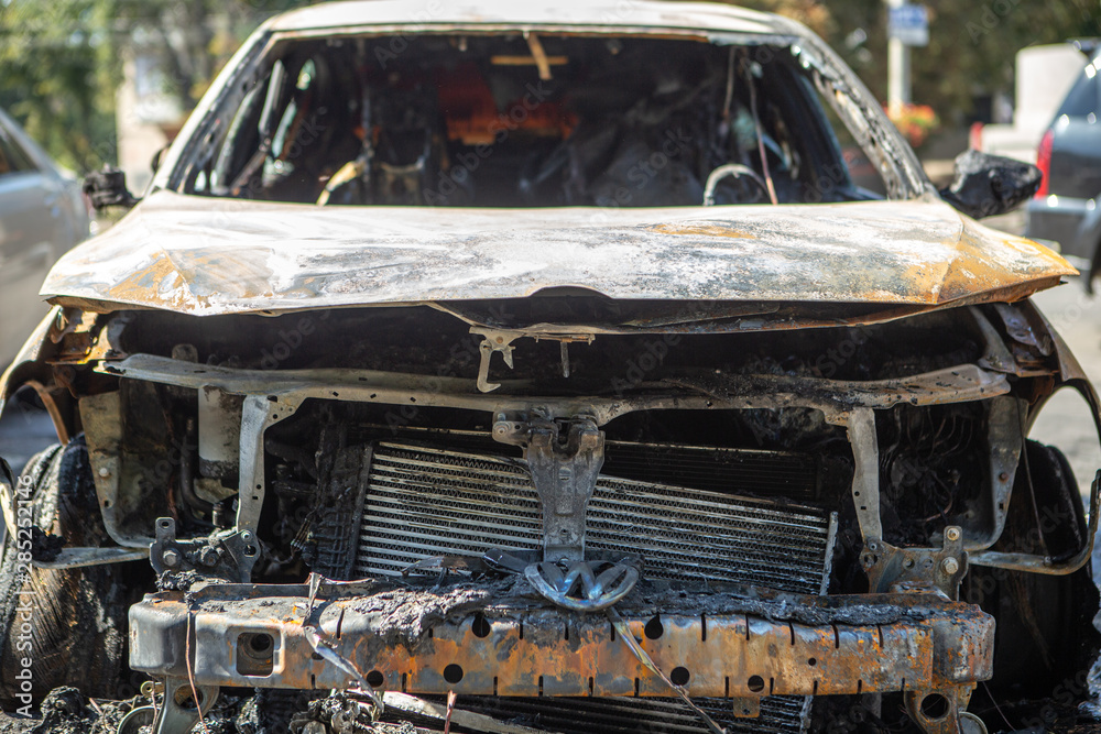21.08.2019 Vinnitsa, Ukraine:burned out the front of the car is in the parking lot. A car damaged by a malicious arson attack