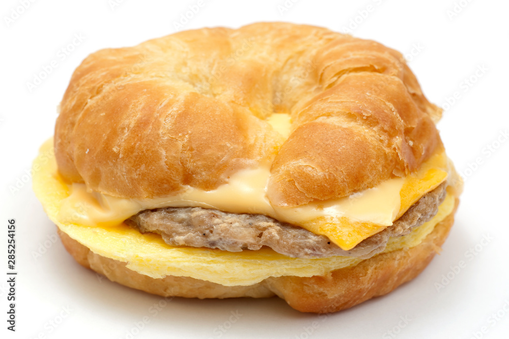 egg,sausage, and cheese croisant, isolated on white