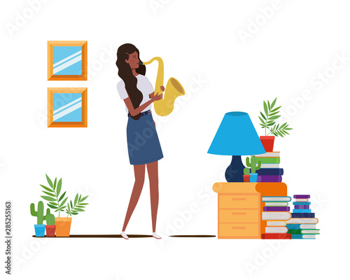 young woman with saxophone on white background
