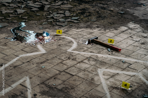Crime Scene with Hammer on dirty floor Weapon of Killing and white chalk Outline of Murdered Body with Blood