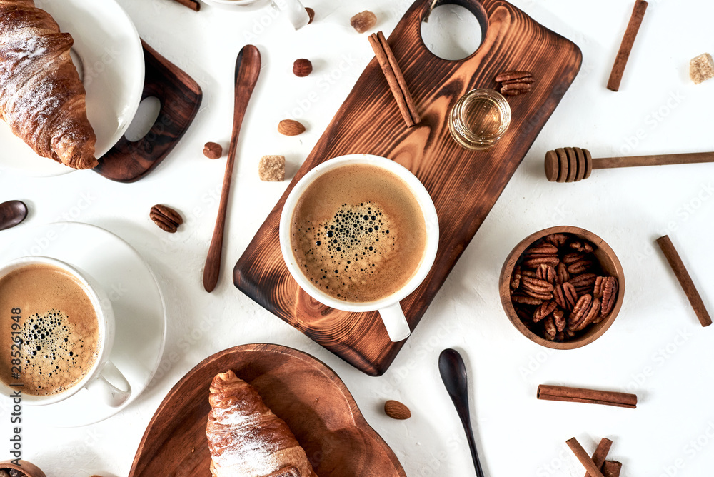 Fototapeta breakfast pattern, croissant, coffee, honey, cinnamon sticks, nuts, sugar. Good morning concept, wake up, sweet life.