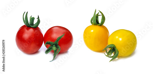 Fresh yellow and red cherry tomatoes on a white background with a sunny shadow. Summer plant. Food product.