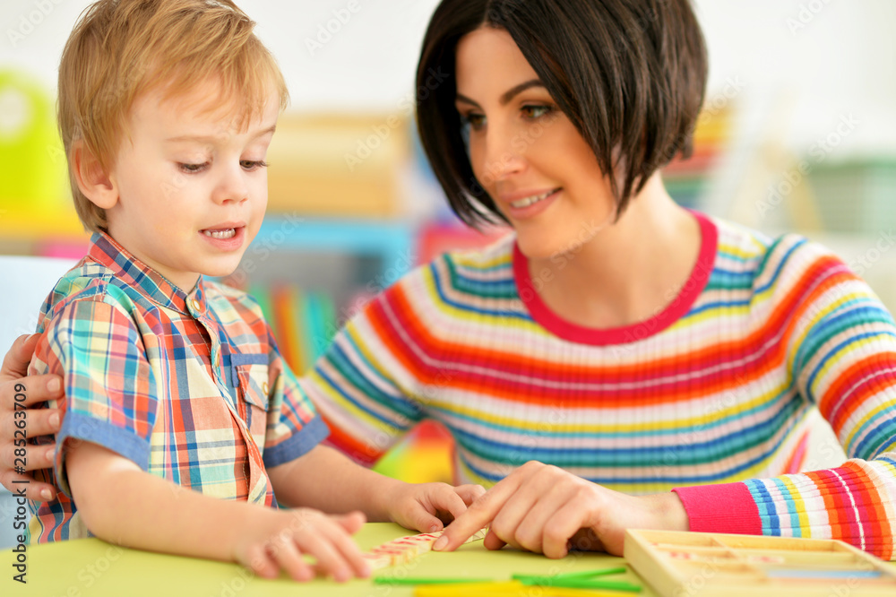 Young mother and cute little son playing Young mother and cute little son playing