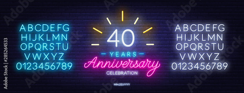 40th anniversary celebration neon sign on dark background. Neon alphabet . Template for invitation or greeting card.