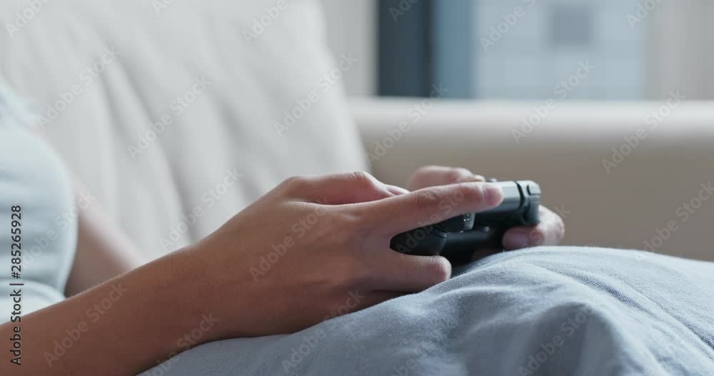 Woman play tv game at home Woman play tv game at home