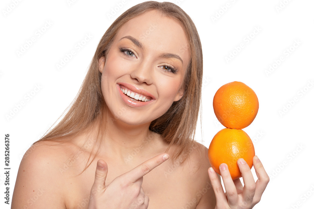 Portrait of young woman posing with oranges Portrait of young woman posing with oranges