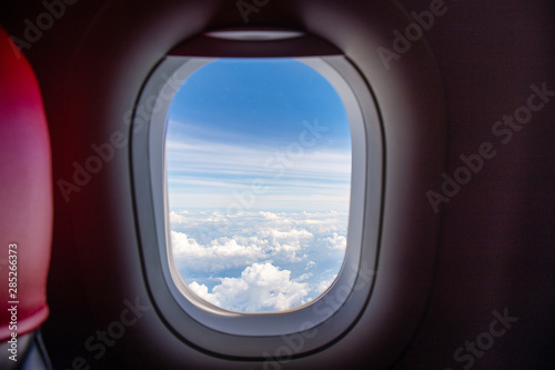 aerial view of cloud scape from window airplane window economic seat after take off from airport for transportation © kunchainub