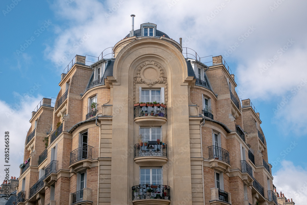 Fototapeta premium A Typical parisian building facade with its windows and balcony