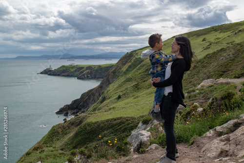 Idylic landscape in Ireland,  mother and kid traveling
