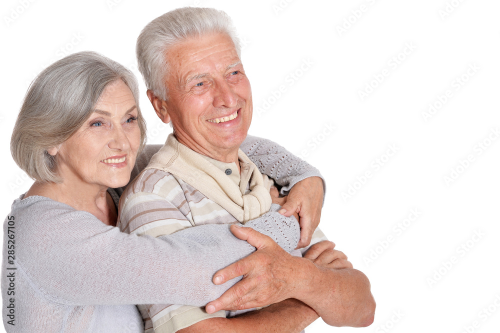 Portrait of happy senior couple hugging on white background Portrait of happy senior couple hugging on white background