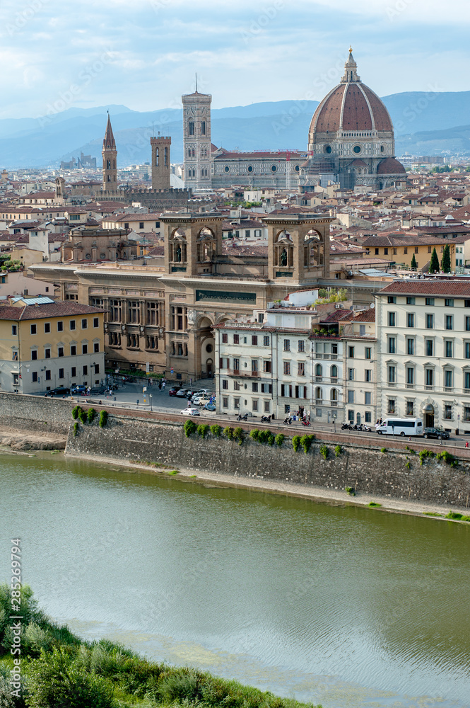 Florence cityscape with Arno river in a summer day.