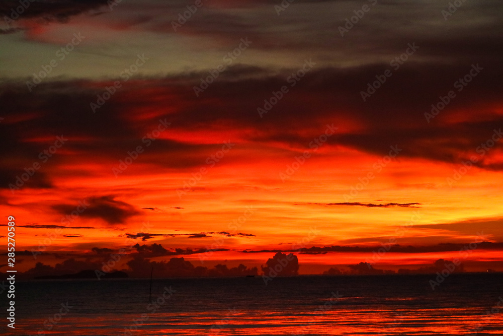 sunset on sea and ocean last light red sky silhouette cloud