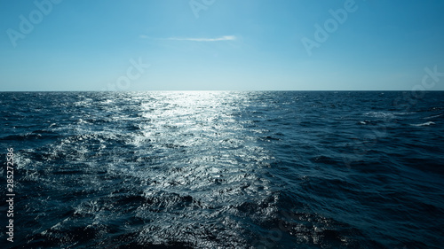 Billede på lærred Horizontal and sea water surface, Dark blue ocean water for natural background