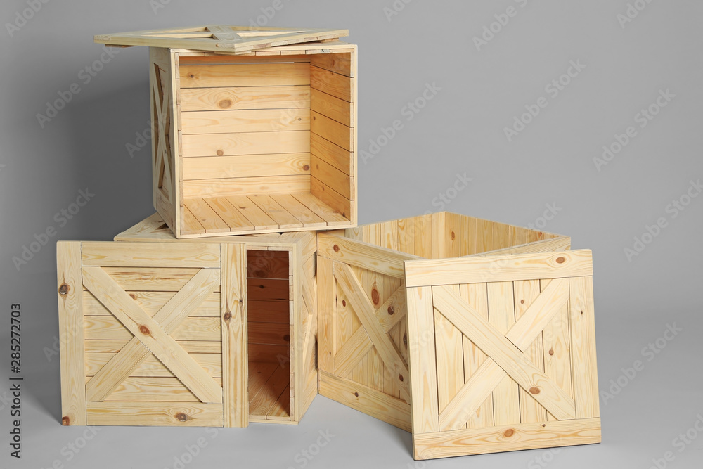 Group of wooden crates on grey background Group of wooden crates on grey background