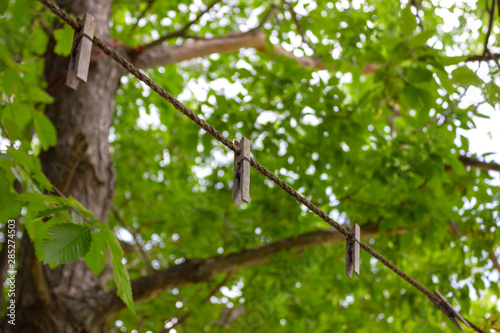 clothespin pin and clothesline for drying clothes outdoors in summer horizontal